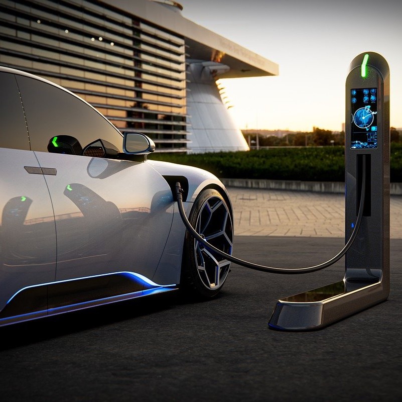 An Electric Vehicle Charges its Li-Ion Battery at an Electric Car Charging Station Outside